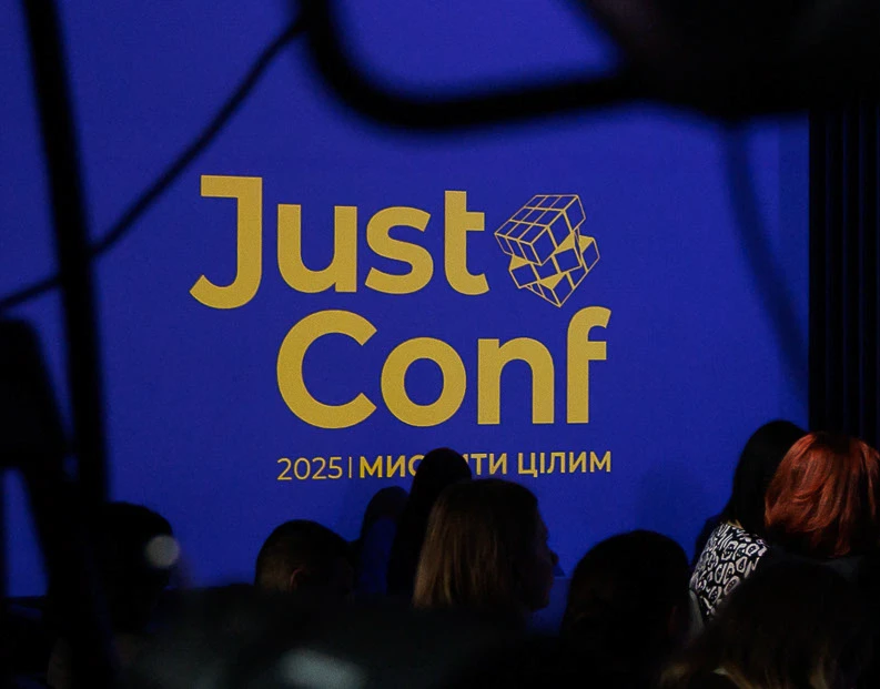 JustConf 2025 visual identity presented at the event